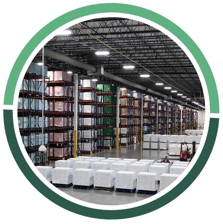 warehouse with palettes on the ground, a red forklift, and floor-to-ceiling shelving units full of materials
